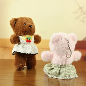 Cute plush bear keychains in brown and pink with cherry lace outfits and metal rings