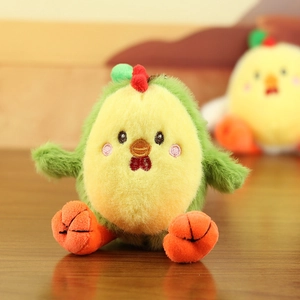 Close-up of plush chick avocado keychain showing soft texture and detailed embroidery