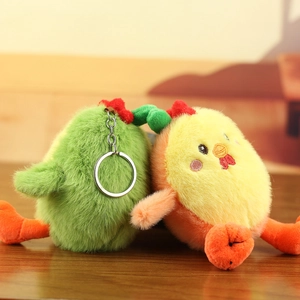 Close-up of cute green and yellow plush chick keychains with soft fur and metal rings