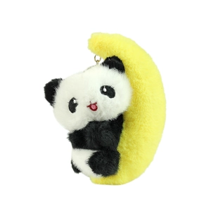 Cute panda plush on a yellow crescent moon with a golden keychain on white background