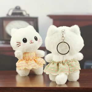 Cute white plush cat keychain charms with floral lace dresses shown in front and back views