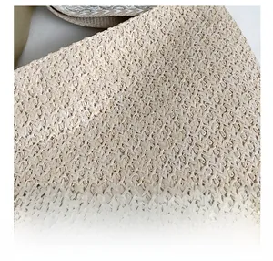 Detailed close-up showing the premium cross-woven texture of the straw tote bag