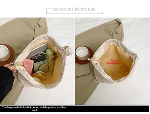 Detail view of woven shoulder bag interior capacity showing tablet and daily essentials