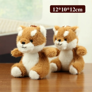Plush Shiba Inu keychain 12x10x12cm with soft brown and white fur on a wooden table