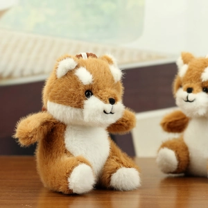 Detail of a fluffy Shiba Inu plush keychain with soft fur texture and hanging strap