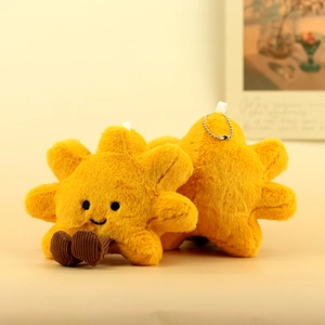 Detailed close-up of plush yellow star charms with smiling faces and soft corduroy feet