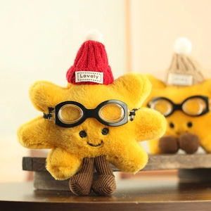 Detail of plush flower doll with knit hat, goggles and Lovely tag for bag pendant