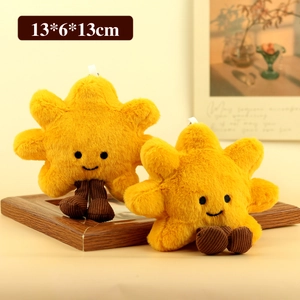 Cute yellow star plush keychain with smiling face and corduroy legs on a wooden frame