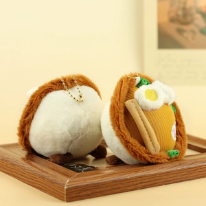 Close-up of cute plush noodle bowl pendants with soft texture and golden bead chains