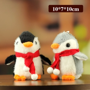 Cute plush penguin keychains in black and grey with red scarves and metal chains