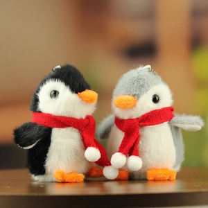 Cute plush penguin keychains with red scarves, soft grey and black couple bag charms