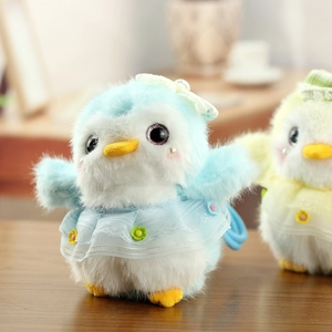Detail of cute blue plush penguin with lace dress and pearl headpiece for bag charm