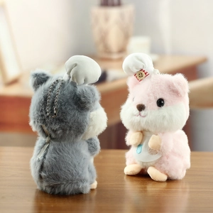 Detailed close-up of cute hamster plush keychains wearing chef hats and aprons