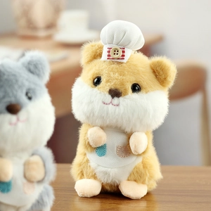 Detailed shot of hamster plush keychain wearing a chef hat and apron with embroidery
