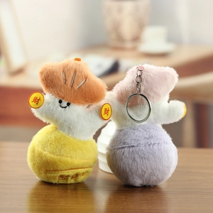 Simpatici portachiavi in peluche a forma di cartone animato in giallo e viola con morbida texture