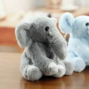 Close-up of soft plush elephant toys showing grey and blue colors with focus on fabric