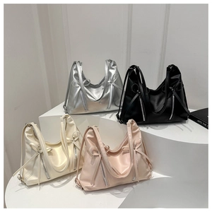 Detailed view of large leather tote bags with bow knot straps in four stylish colors