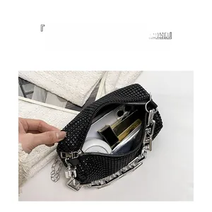 Detail view of the spacious inner compartment of this sparkling black rhinestone handbag