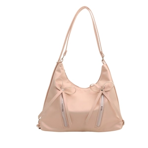 Pink nylon shoulder tote bag with elegant bow zipper details and slender dual straps