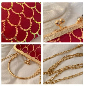 Macro details of red sequin evening bag with gold floral frame and chain strap
