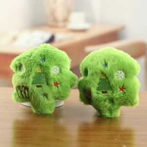 Detail of two plush Christmas tree ornaments with soft faux fur and delicate embroidery