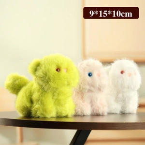 Plush cat doll pendants in green, pink and white colors standing on a wooden surface