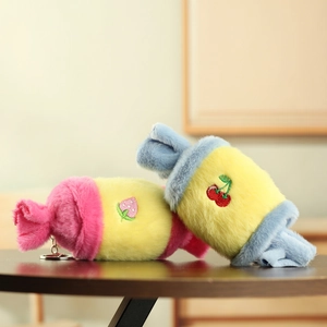 Detailed view of colorful plush candy keychains with strawberry and cherry embroidery