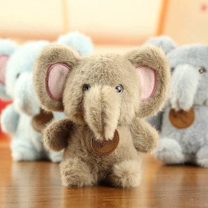 Close-up of adorable elephant plush pendants in brown, blue, and grey soft textures