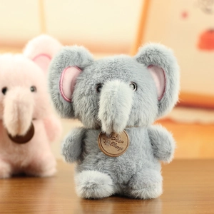 Close-up of gray and pink plush elephant toys with soft long fur and wood tags