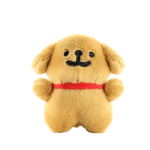 Golden plush puppy keychain toy with soft long fur and red collar on white background