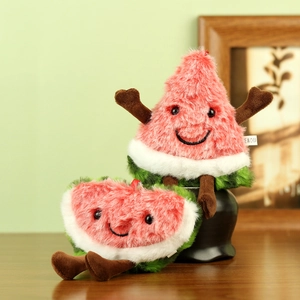 Detail shot of cute plush watermelon toys with anthropomorphic limbs on a wooden table