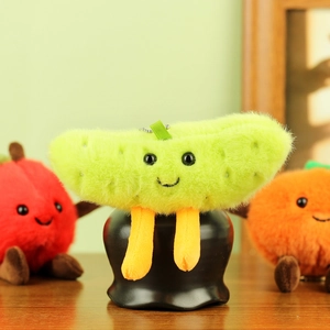 Detail of cute green fruit plush pendant with long fur, orange legs, and metal ball chain