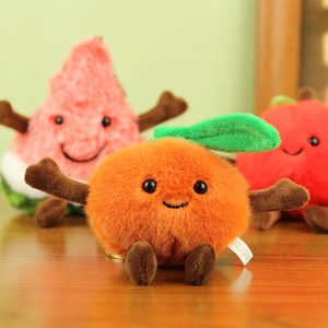 Detailed view of plush orange doll with soft texture and cute embroidered smile facial expressions