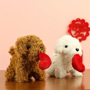 Close-up of curly plush teddy dog keychains in brown and white with red hearts