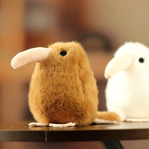 Macro detail of plush kiwi bird plushie showing soft faux fur and long beak texture