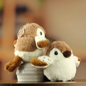Close-up of bird sparrow plush keychain with soft fur texture and metal ring detail