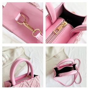 Detail view of pink quilted tote bag showing golden hardware, texture and stitching