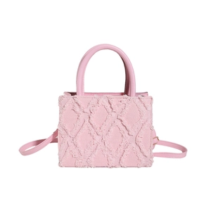 Pink denim tote bag with quilted fringe texture and detachable leather shoulder strap