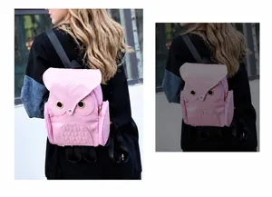 Detailed side view of pink cartoon owl backpack showing zipper pockets and quilted texture
