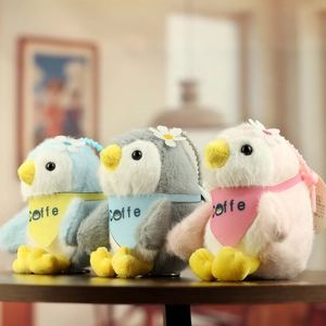 Three cute penguin plush keychains with coffee scarves in blue, grey and pink colors