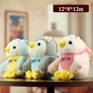 Plush penguin keychain set with colorful bibs and daisy detail for bag decoration