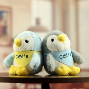 Cute plush penguin charms with scarves and flower decor for bags or keychains