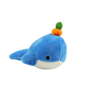 Cute sky blue whale plush toy with carrot decoration and white belly on white background