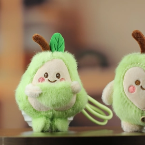 Close-up of a plush avocado keychain with a cute smiling face and soft green fur textures
