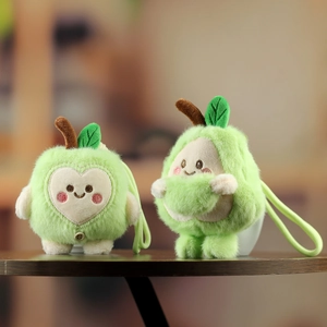 Detailed close-up of cute plush avocado pendants with soft texture and green lanyard