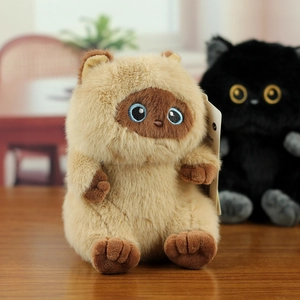 Close-up of cute plush cat keychain showing soft brown long faux fur texture and tag