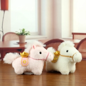 Close-up of plush horse pendants with gold ingots and embroidered saddles on wood
