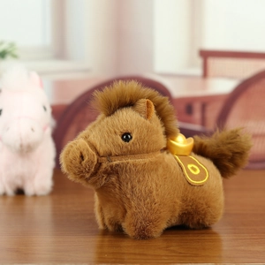 Macro detail of brown plush pony keychain with gold ingot and saddle on wooden table