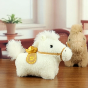 Close-up of white plush horse mascot with a golden ingot decoration on wooden surface