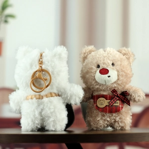 Cute teddy bear plush keychains in white and brown with handmade tag and metal clasp